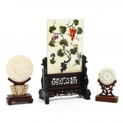 three-chinese-jade-carvings-in-stands