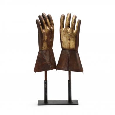 a-pair-of-industrial-rubber-glove-molds-presented-as-sculptures
