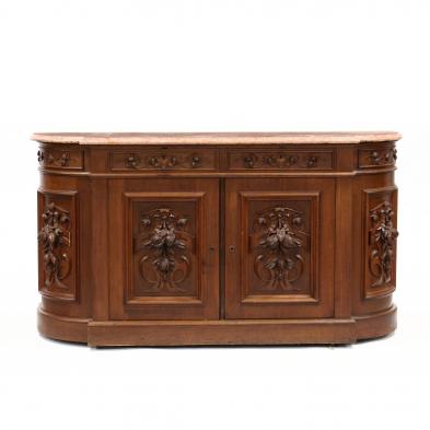 an-american-renaissance-revival-carved-walnut-and-marble-top-sideboard
