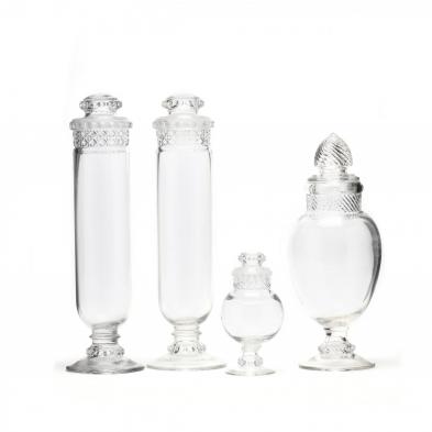 four-molded-clear-glass-apothecary-jars