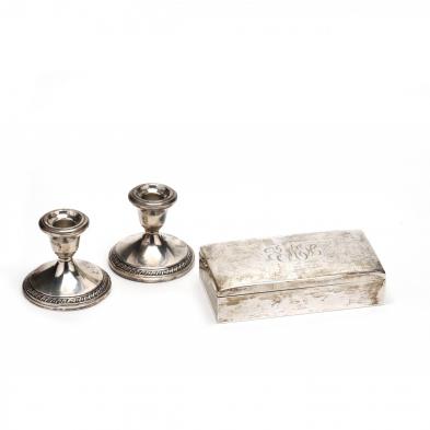 a-sterling-silver-cigarette-box-and-pair-of-candlesticks