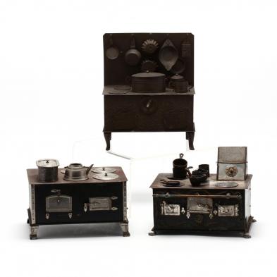 three-antique-miniature-tin-stoves