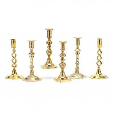 three-pairs-of-antique-brass-candlesticks