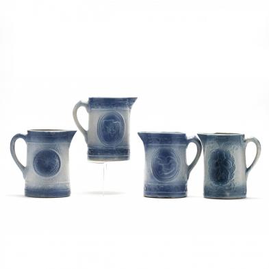 four-blue-stoneware-pitchers