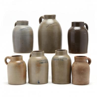 a-group-of-seven-antique-oyster-jars