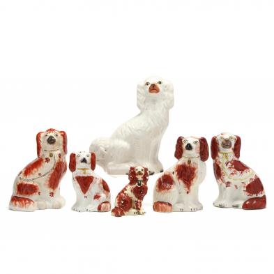 a-grouping-of-six-staffordshire-dogs