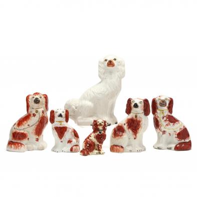 a-grouping-of-six-staffordshire-dogs