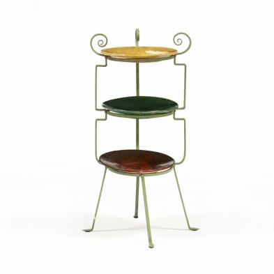 a-tiered-wrought-iron-stand-displaying-j-b-cole-chargers