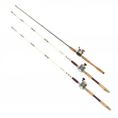three-vintage-fishing-rods-with-reels