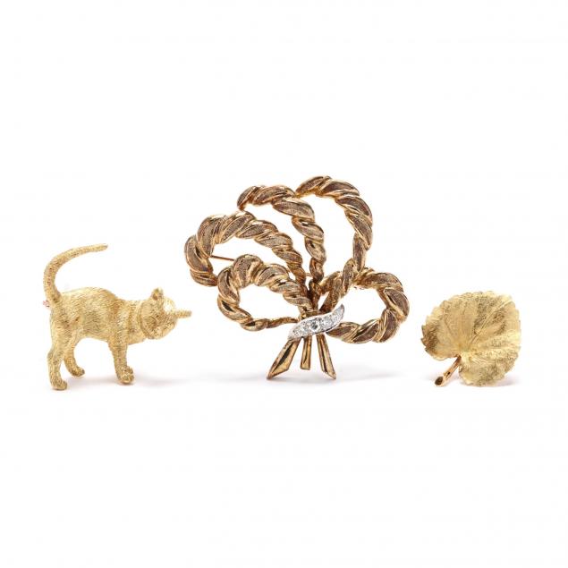 three-gold-brooches