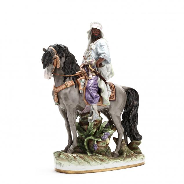 a-large-porcelain-figurine-of-an-arabian-on-horseback