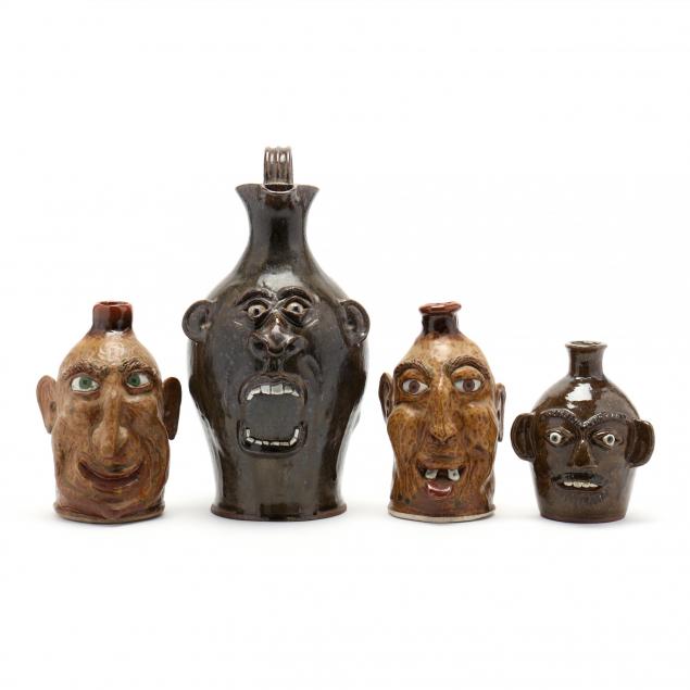 four-western-nc-pottery-face-jugs