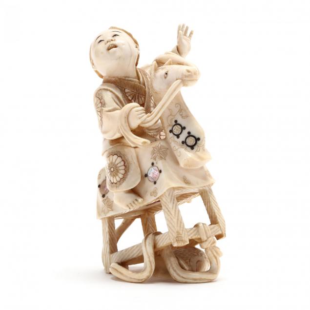 japanese-carved-and-inlaid-ivory-okimono-of-a-boy-on-a-rocking-horse