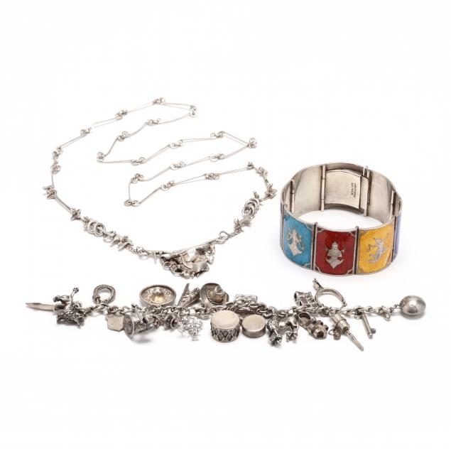 three-silver-jewelry-items
