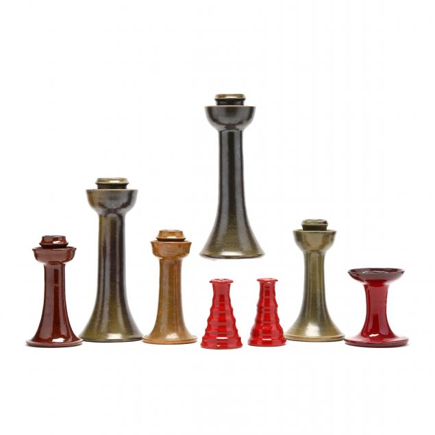 an-assorted-group-of-eight-nc-pottery-candlesticks