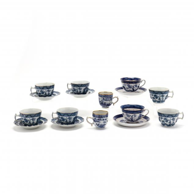 a-group-of-blue-willow-16-cups-and-saucers