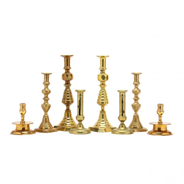 four-pairs-of-antique-brass-candlesticks