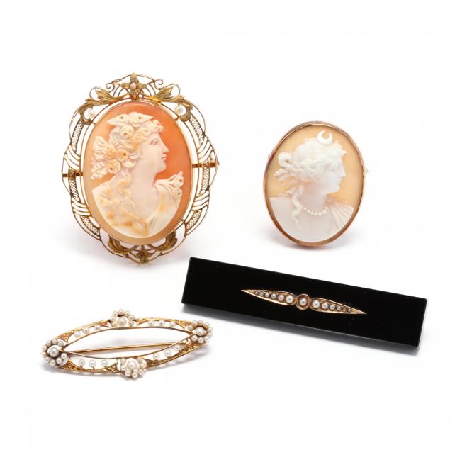 group-of-gold-and-gemstone-brooches
