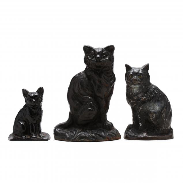 three-vintage-cast-iron-cat-doorstops