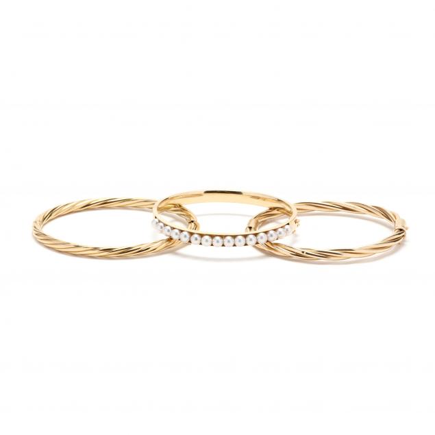 three-gold-bracelets