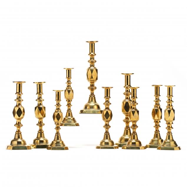 a-suite-of-antique-brass-diamond-candlesticks