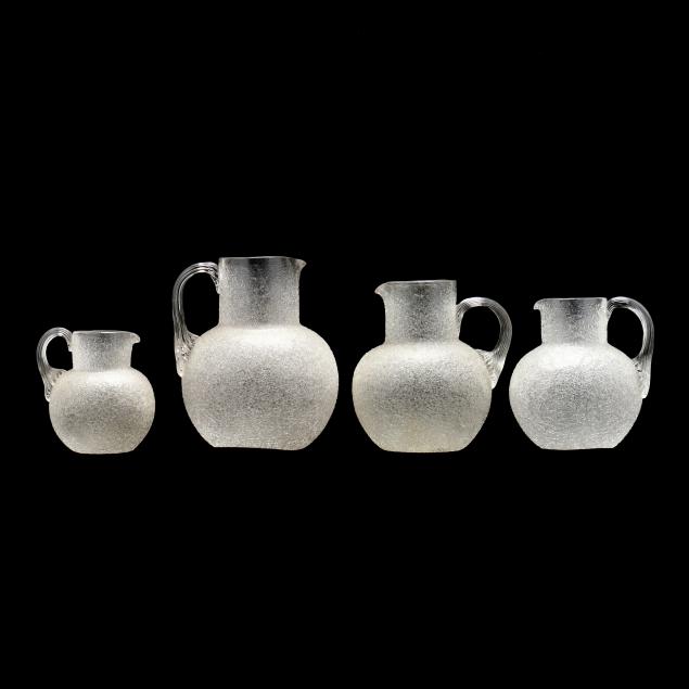 four-graduated-overshot-glass-pitchers