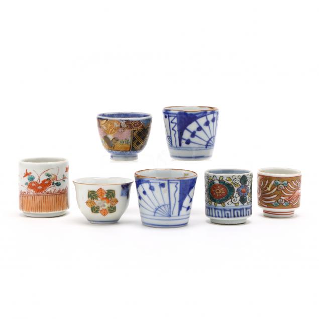 a-group-of-seven-japanese-porcelain-sake-cups