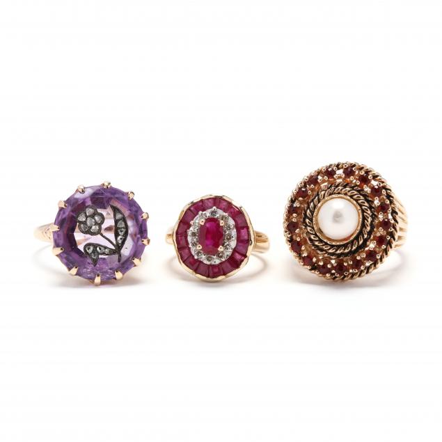 three-gold-and-gem-set-rings