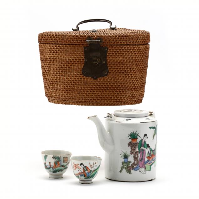 a-chinese-porcelain-teapot-and-cups-in-straw-fitted-basket