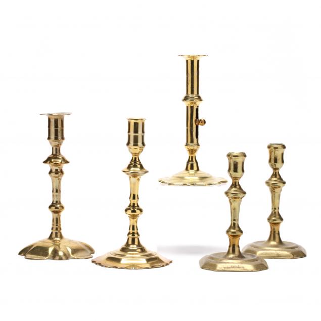 five-antique-brass-candlesticks