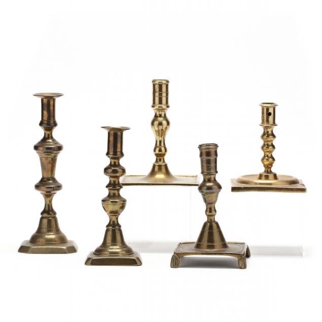 five-antique-brass-candlesticks