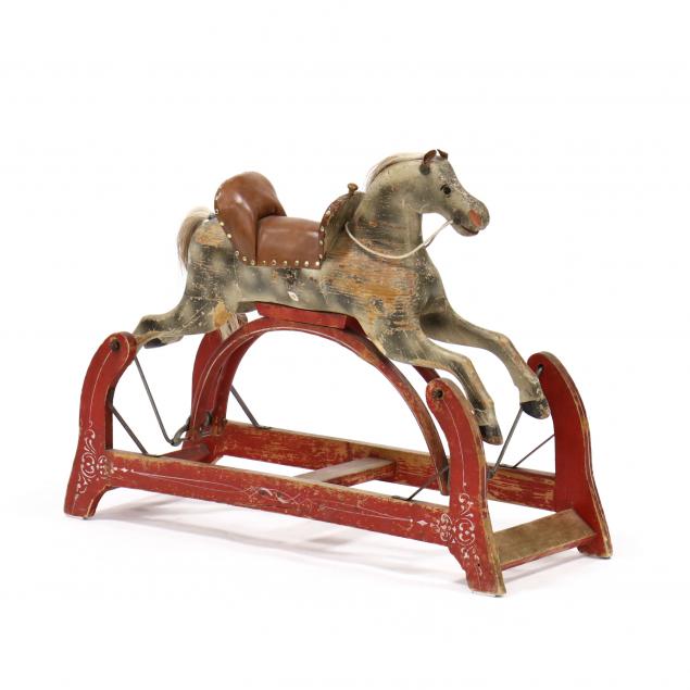 antique-american-rocking-horse-on-platform