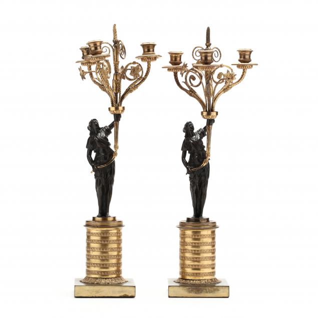 a-pair-of-neoclassical-style-gilt-and-patinated-figural-candelabra