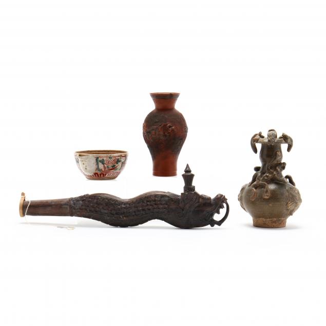 a-group-of-four-asian-decorative-items