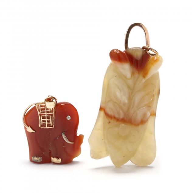 two-gold-and-carved-gemstone-pendants