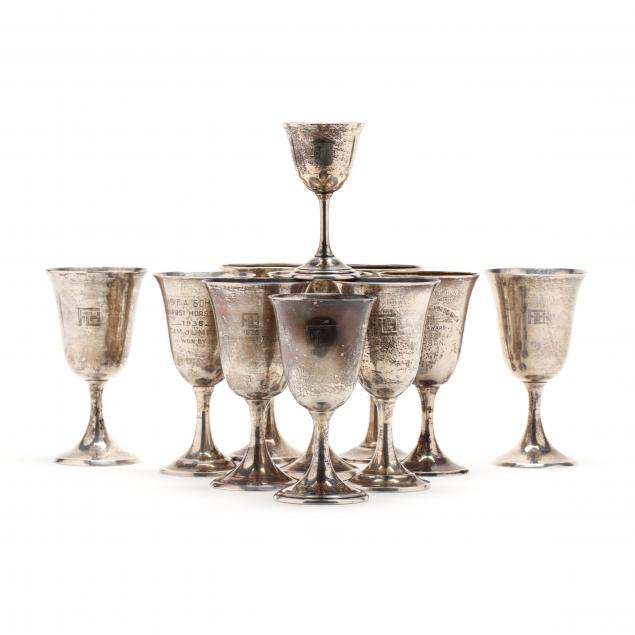 an-assembled-set-of-eleven-sterling-silver-trophy-goblets