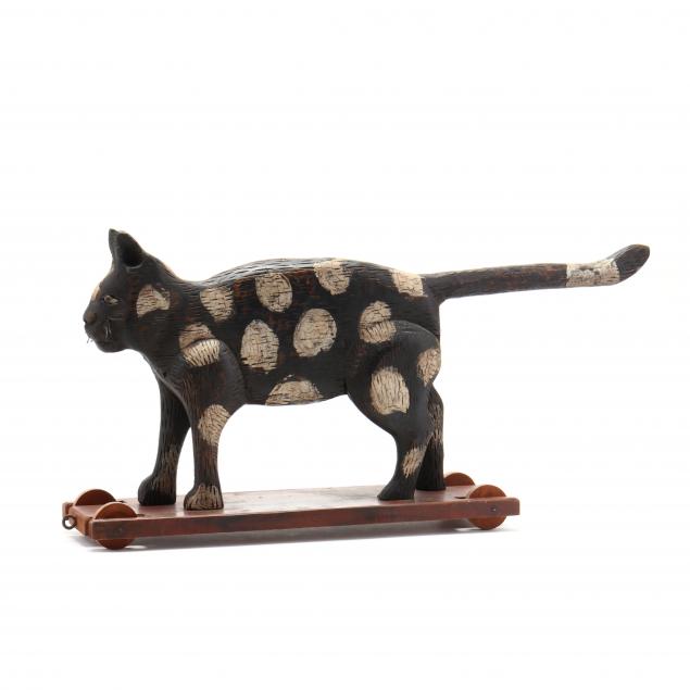 a-painted-and-carved-cat-pull-toy