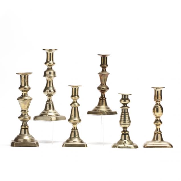 six-antique-brass-candlesticks