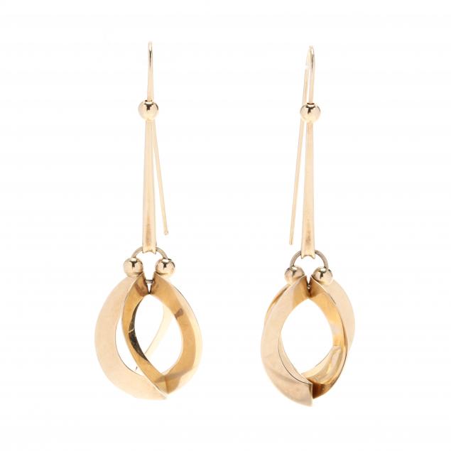 pair-of-gold-dangle-earrings