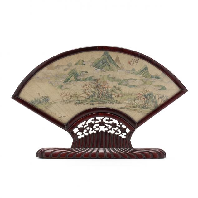 a-chinese-painted-fan-mounted-in-carved-wooden-frame