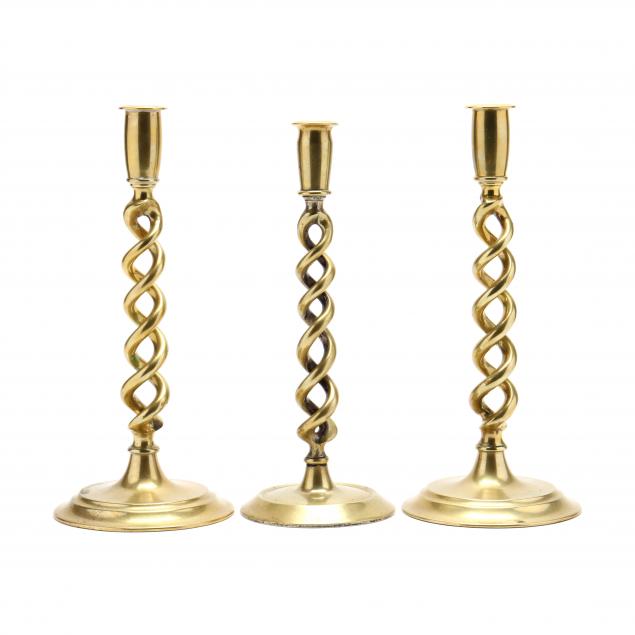 three-antique-english-brass-barley-twist-candlesticks