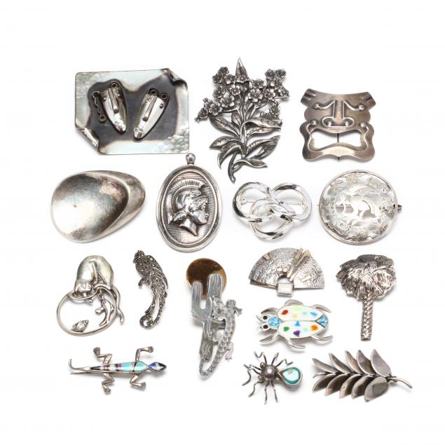 group-of-silver-brooches