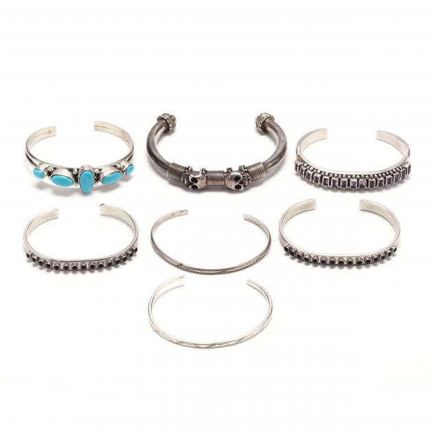 seven-silver-and-gem-set-cuff-bracelets