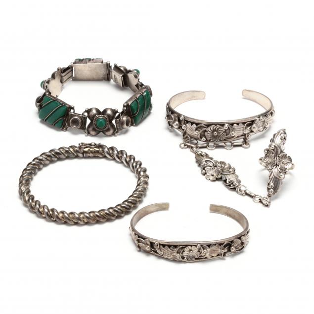 four-silver-bracelets-and-a-ring