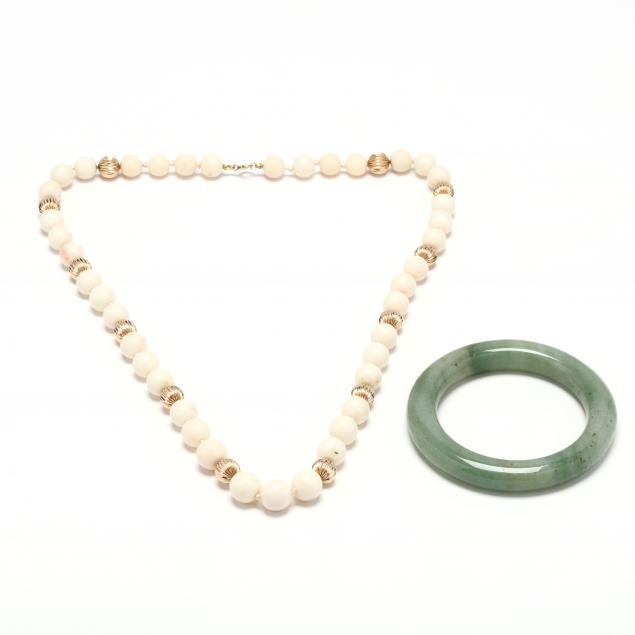 a-gold-and-coral-necklace-and-a-jade-bangle-bracelet