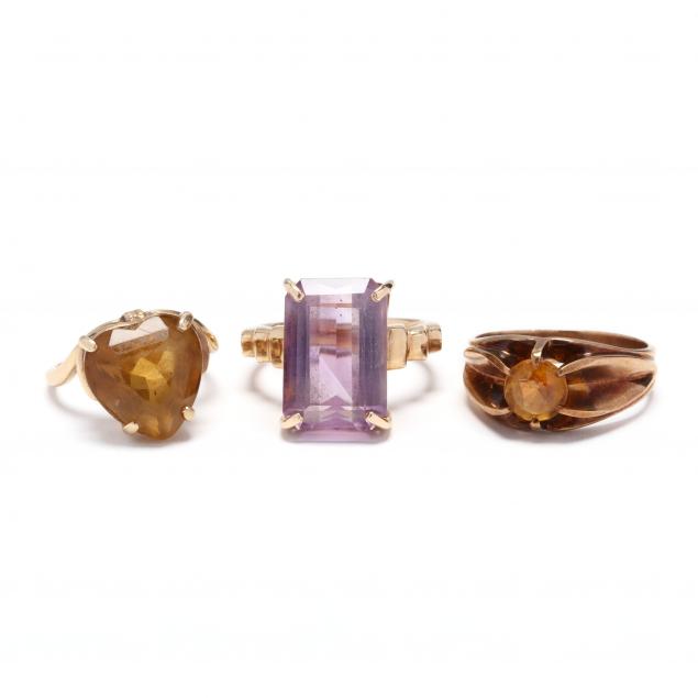 three-gold-and-gem-set-rings