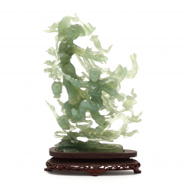 a-chinese-serpentine-jade-carving-with-stand