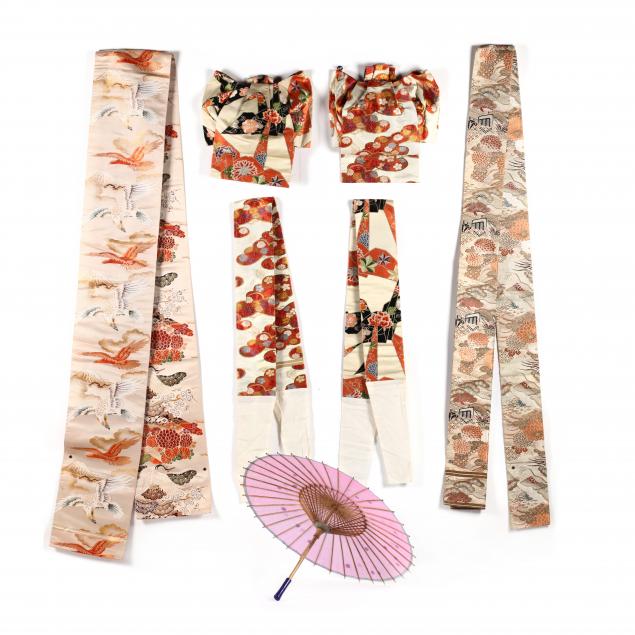 a-group-of-vintage-japanese-obis-and-silk-umbrella