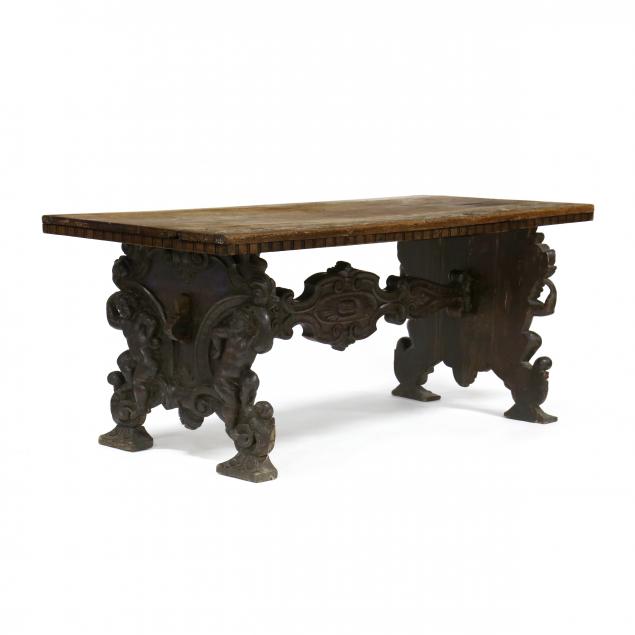 an-antique-renaissance-style-carved-walnut-dining-table