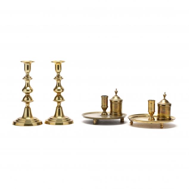 four-antique-brass-candlesticks